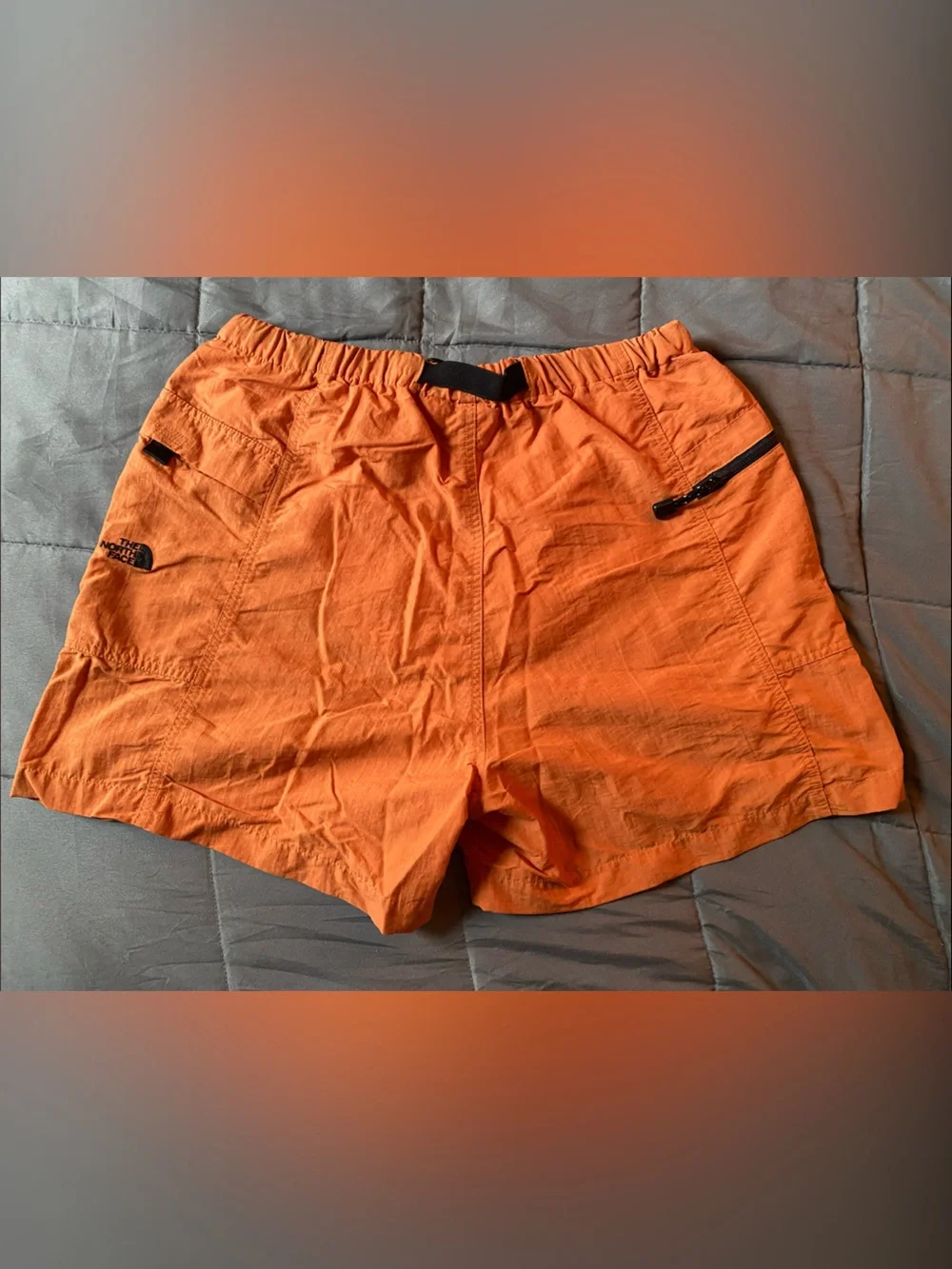 The North Face Men's Orange Athletic Shorts with Buckle Waist